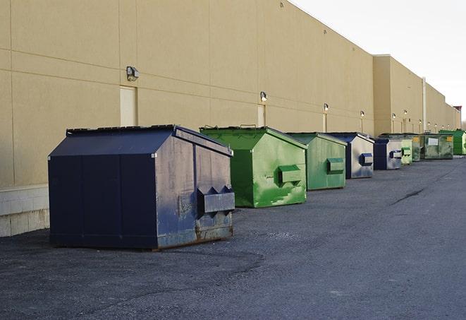 dumpsters lined up for use on busy construction site in Cliffwood